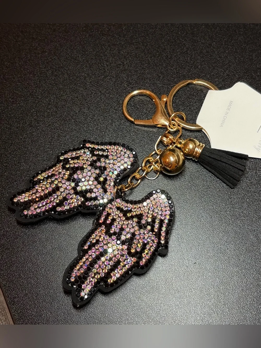 Gold-Tone Iridescent Crystal Angel Wing Keychain with Black Tassel